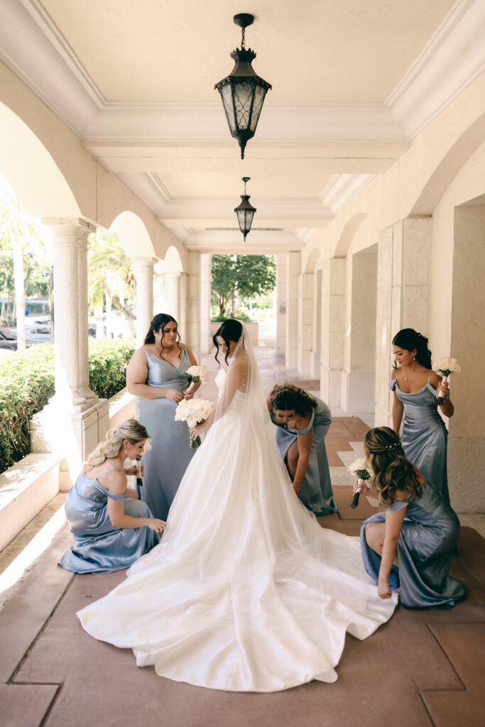 bride surrounded by bridesmaids by wedding photographer west palm beach