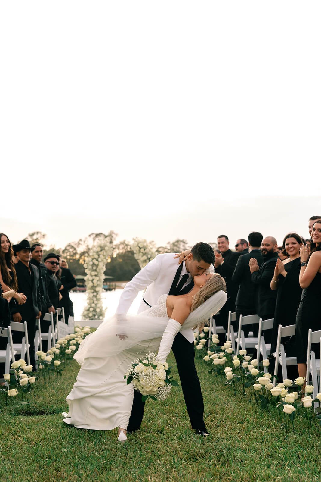 image of bride and groom kissing by best wedding photographer west palm beach