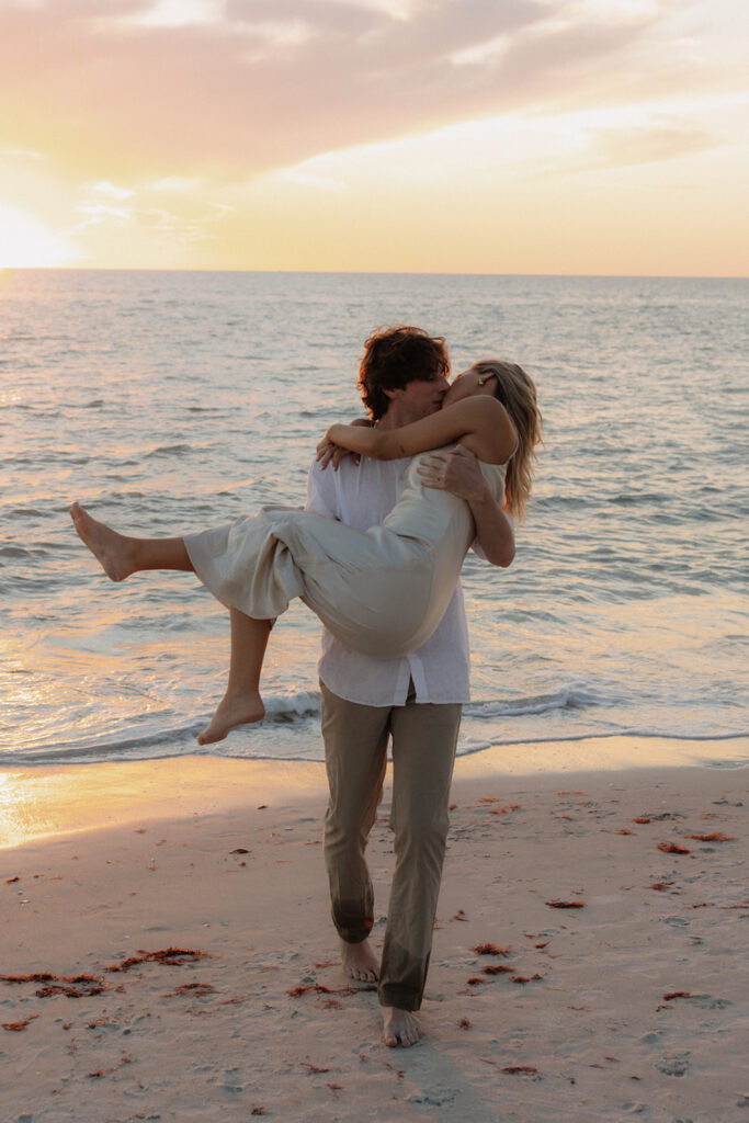 naples florida beach sunset engagement with couple embracing