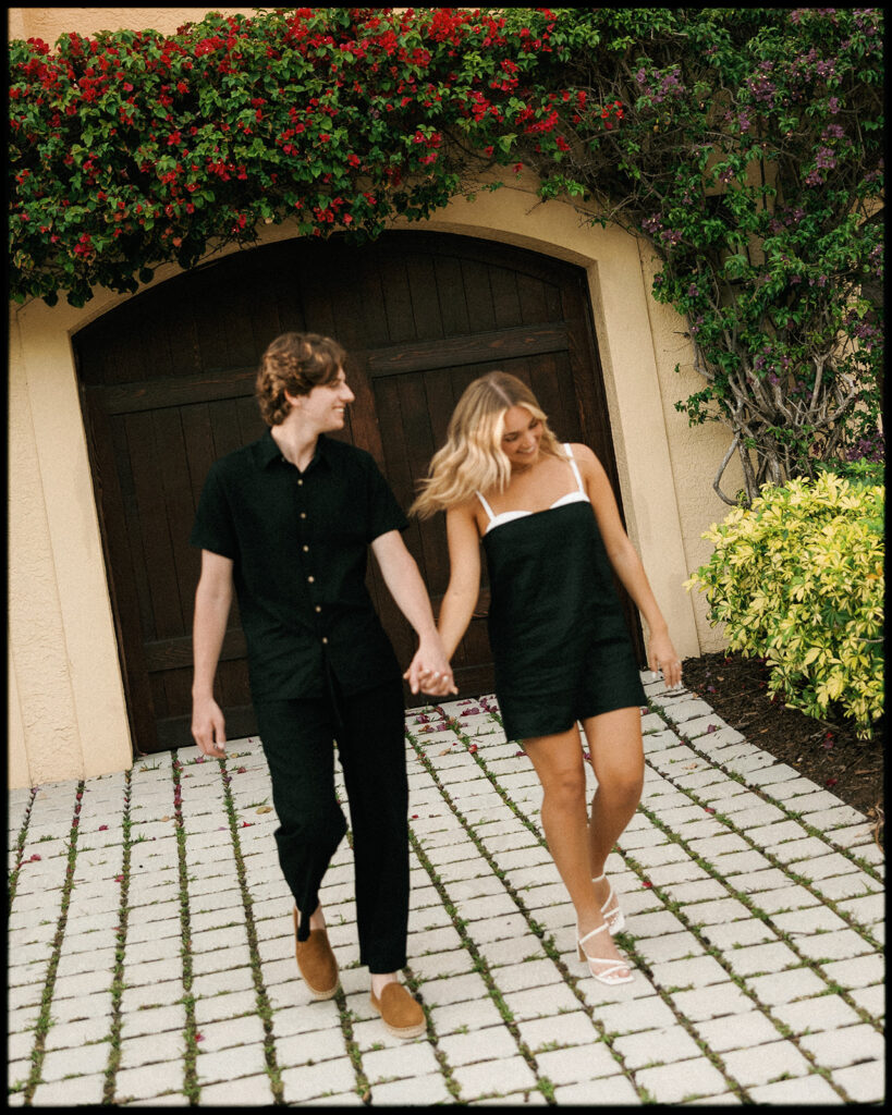 Downtown naples florida engagement session with couple walking