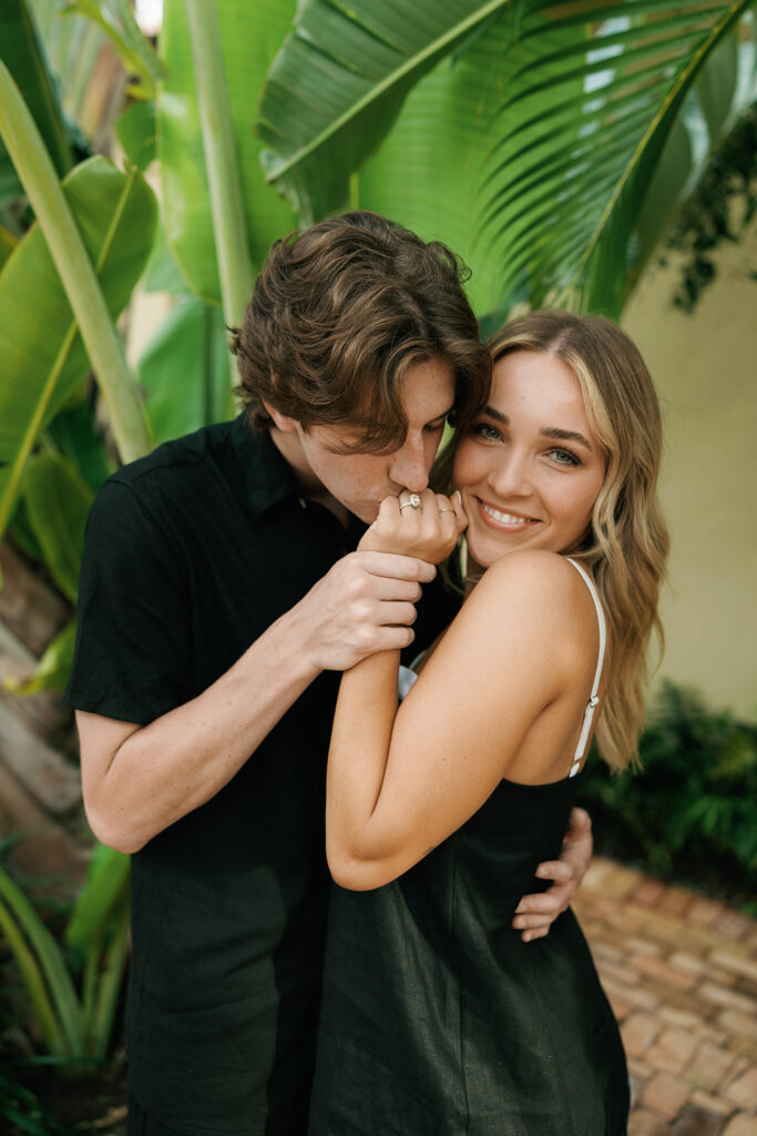 downtown naples beach engagement with couple kissing