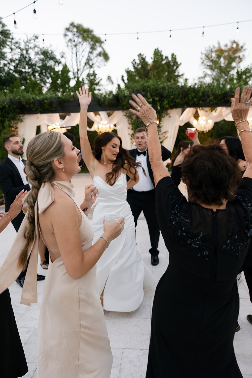 the bridal party dancing at the wedding reception at la casa toscana