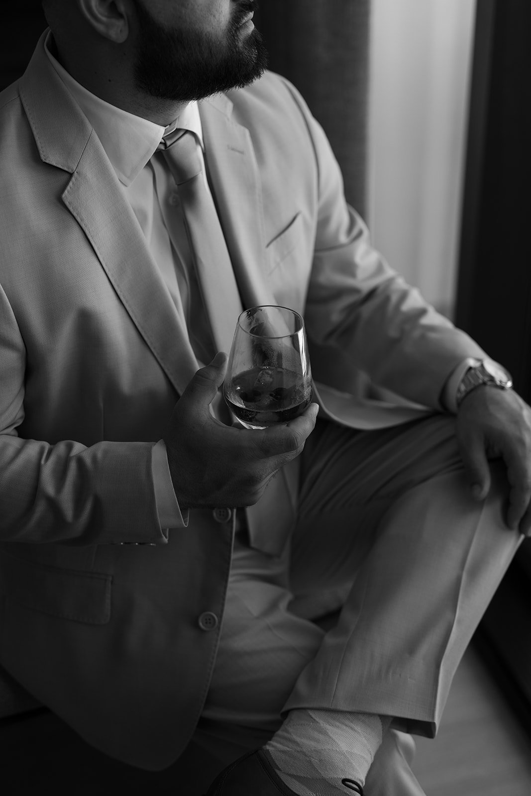 the groom enjoying a drink before his fort lauderdale marriott harbor beach wedding