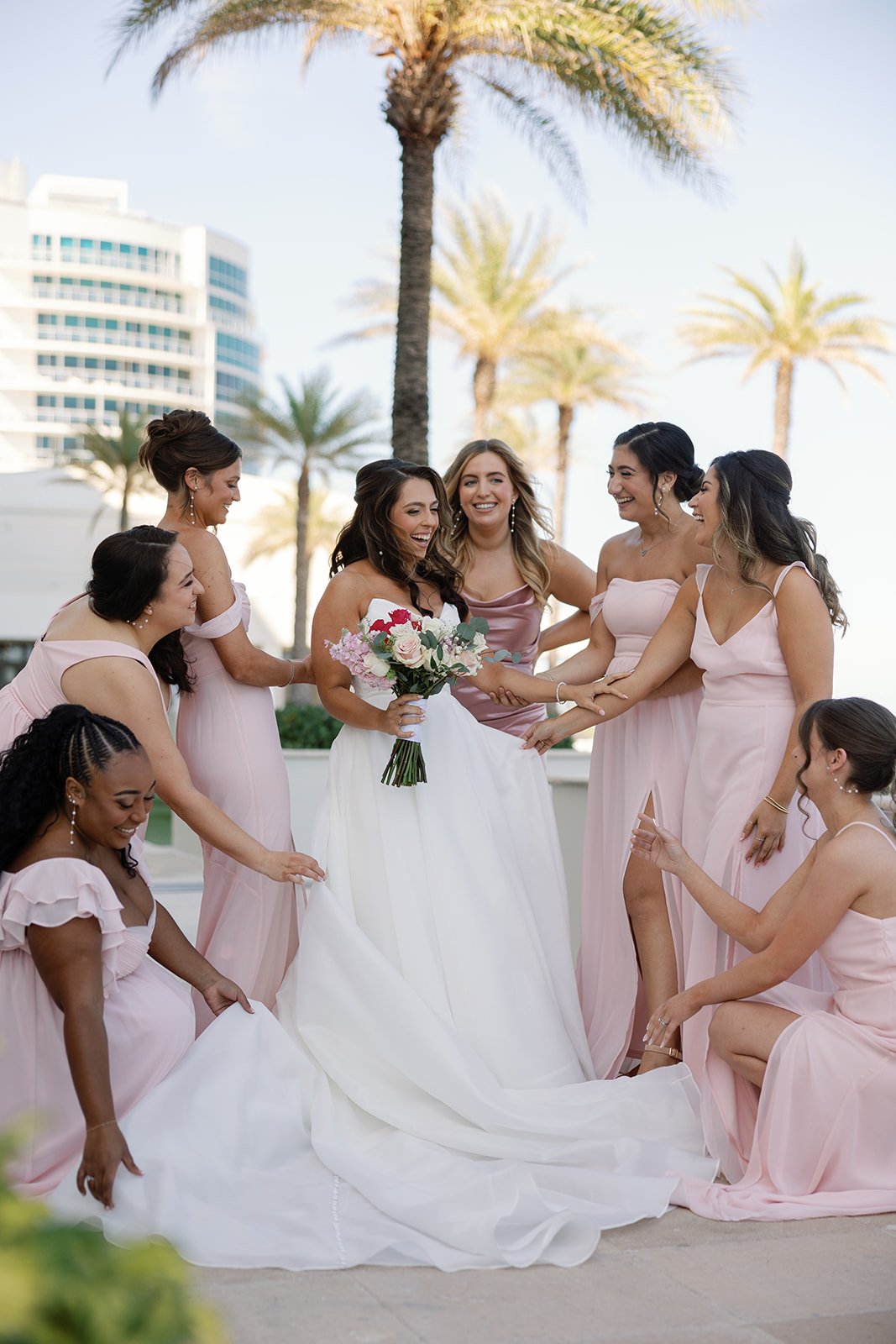a picture of all of the bridesmaids together by a naples florida photographer and videographer