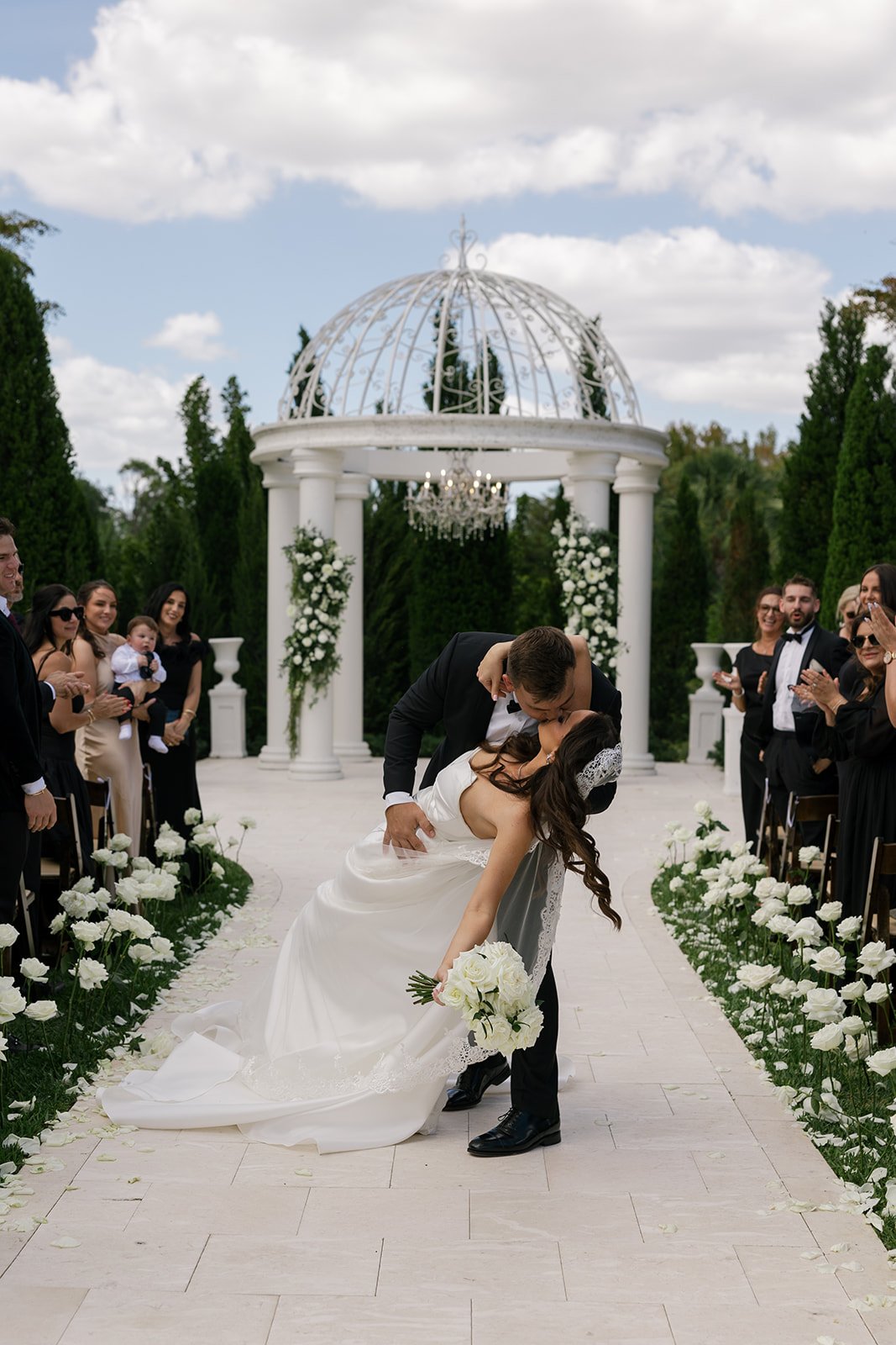 the kiss at the end of the ceremony at their la casa toscana wedding