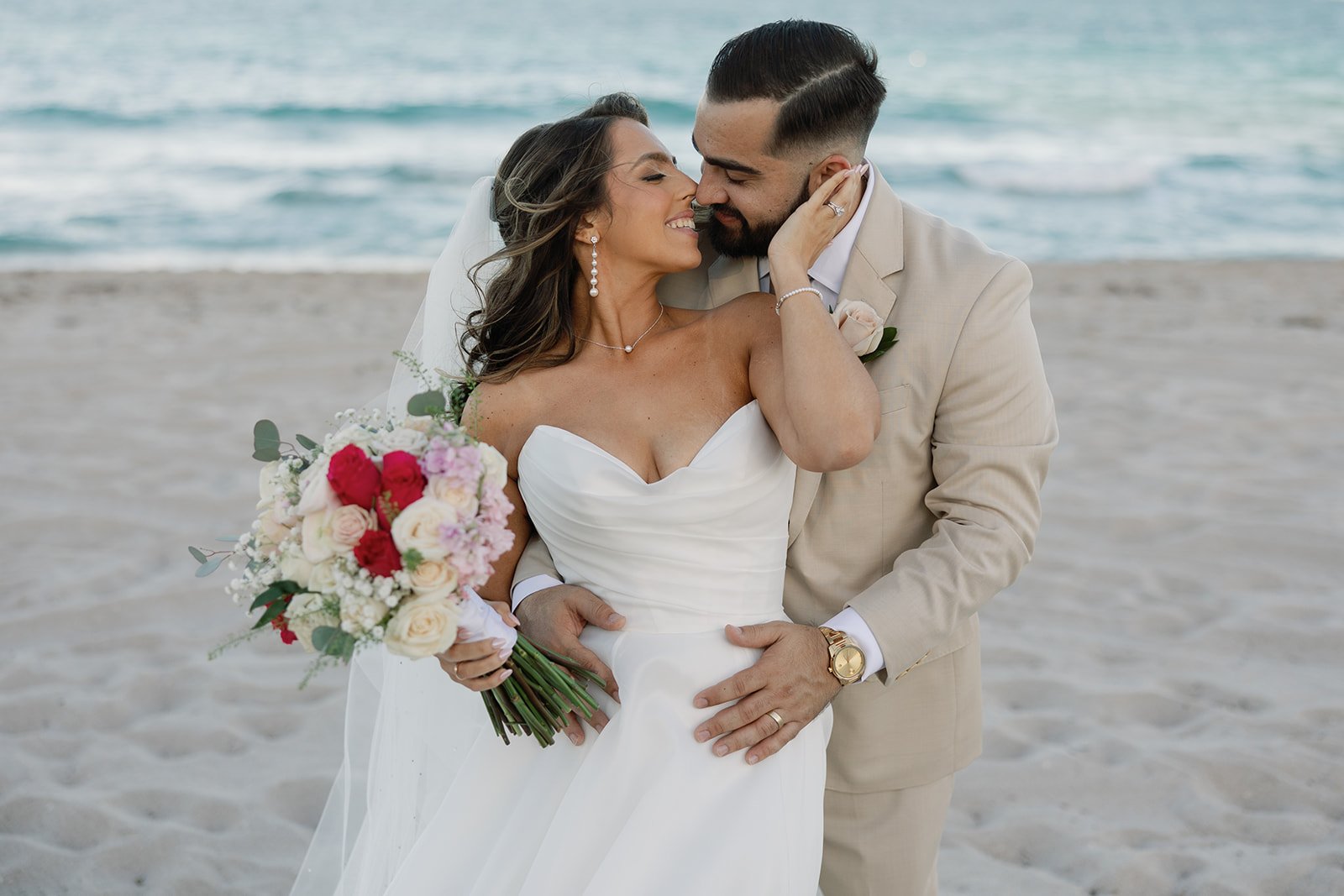 A photo of the couple on the beach by miller photo & film