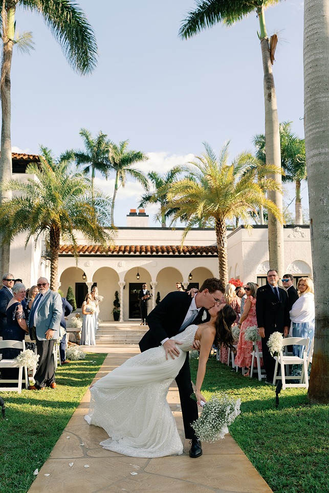 the bride and groom kissing at the Alderman House captured by a south florida photographer