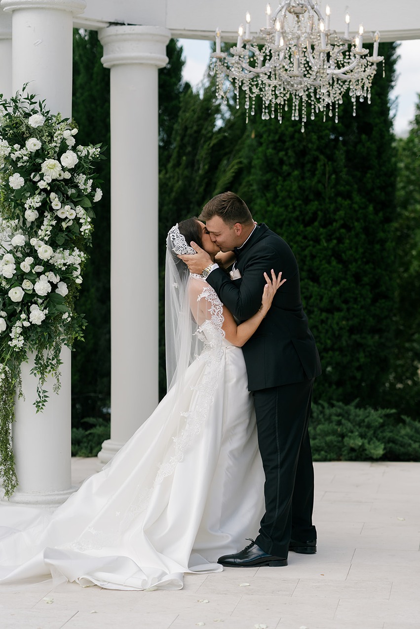 the bride and groom kissing at la casa toscana a south florida wedding venue
