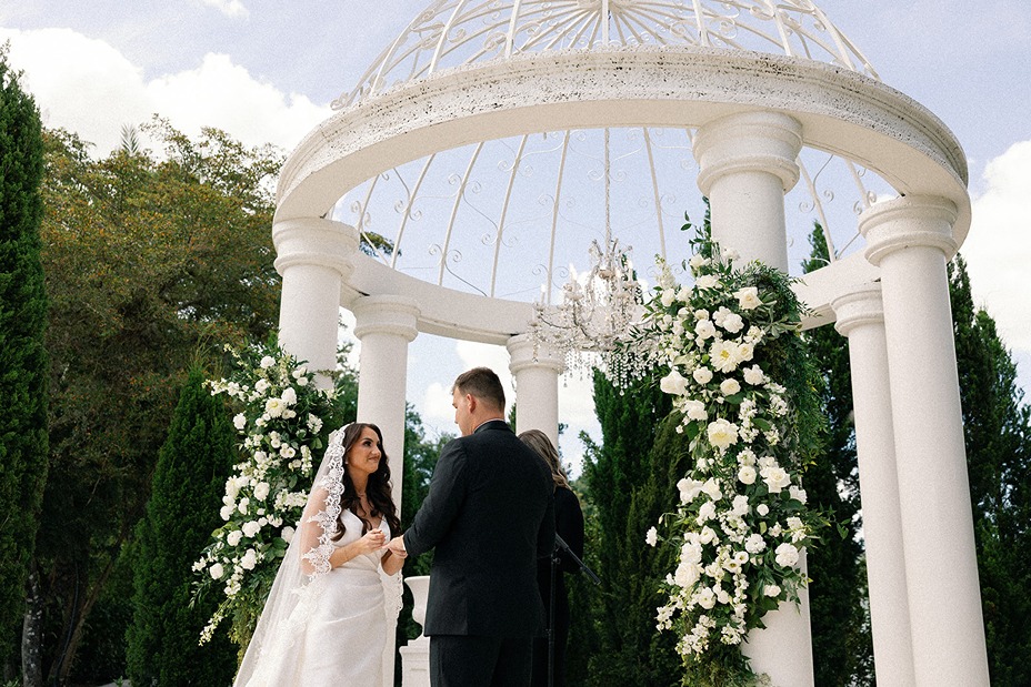 the bride and groom exchanging vows at la casa toscana a south florida wedding venue