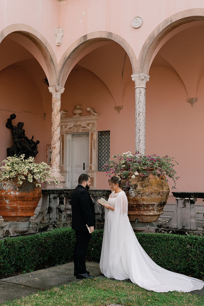 the bride and groom exchanging vows at the ringling one of the best wedding venues in south florida