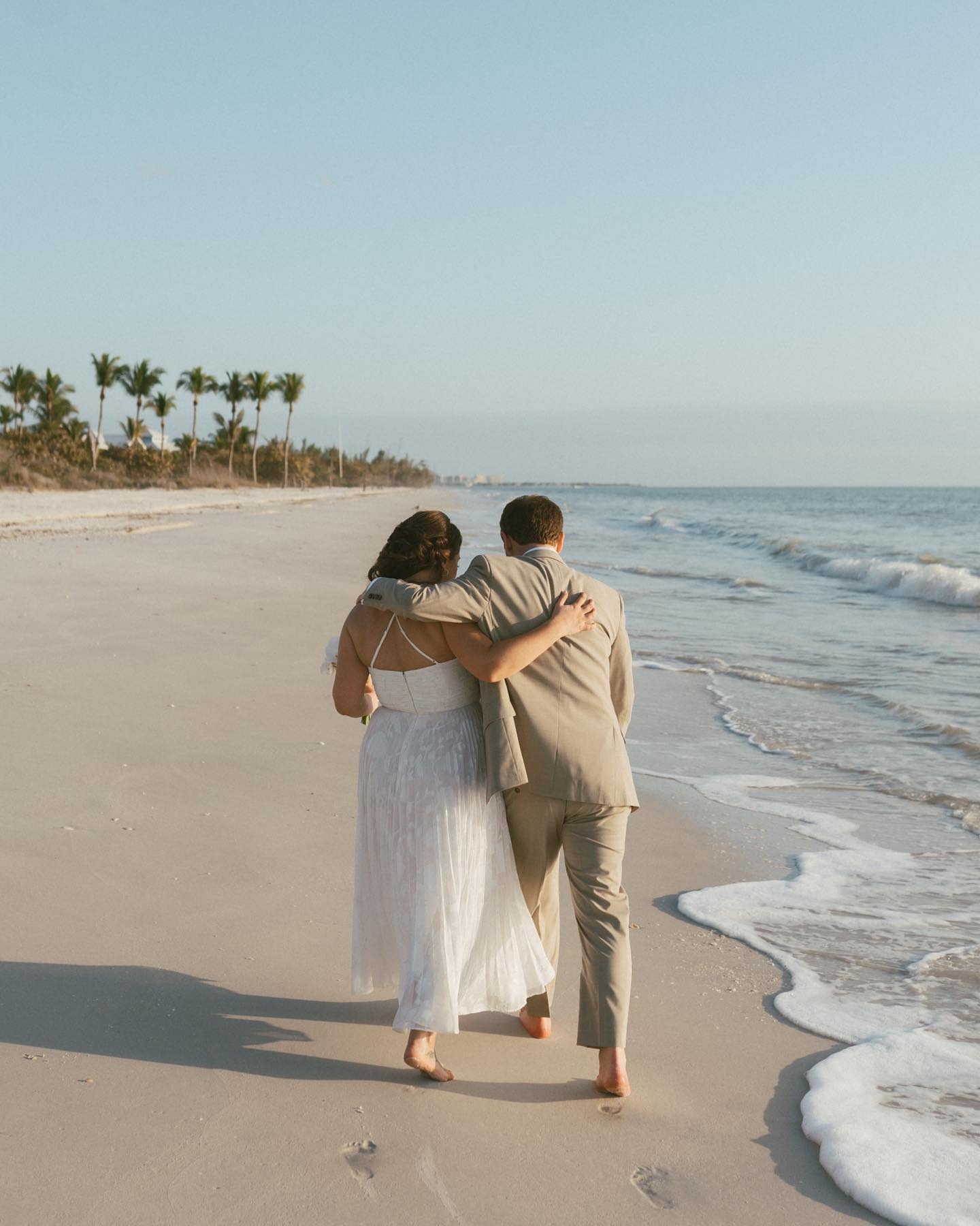 a couple on the beach at off the hook hideaway a naples fl wedding venue