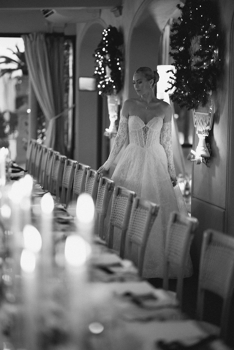 a photo of the bride walking through the her reception captured by an italy destination wedding photographer