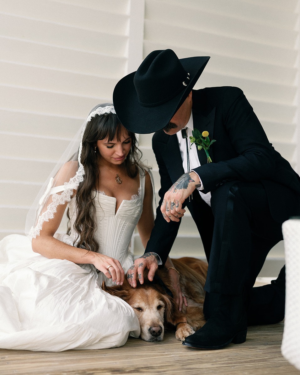 a bride and her pup at the isla bella beach resort restaurant