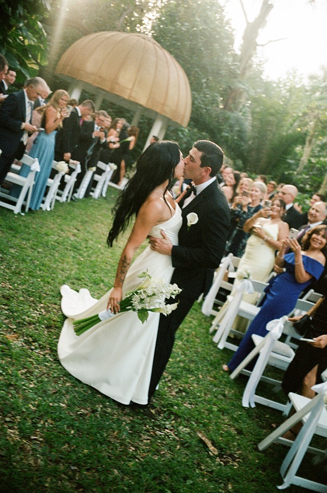 the bride and groom kissing at their shangri la bonita springs wedding