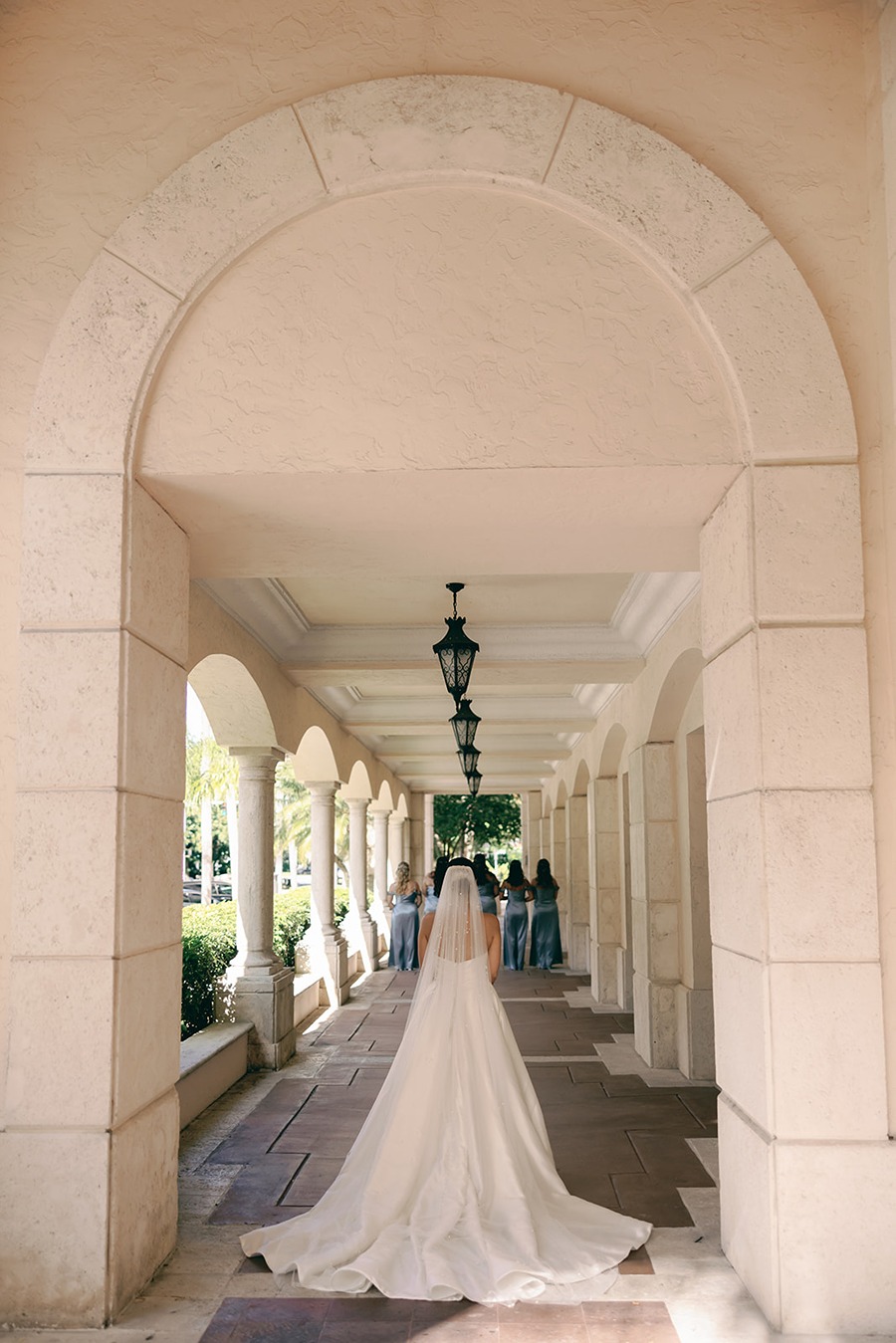 the bride approaching her bridesmaids for their miami wedding photos