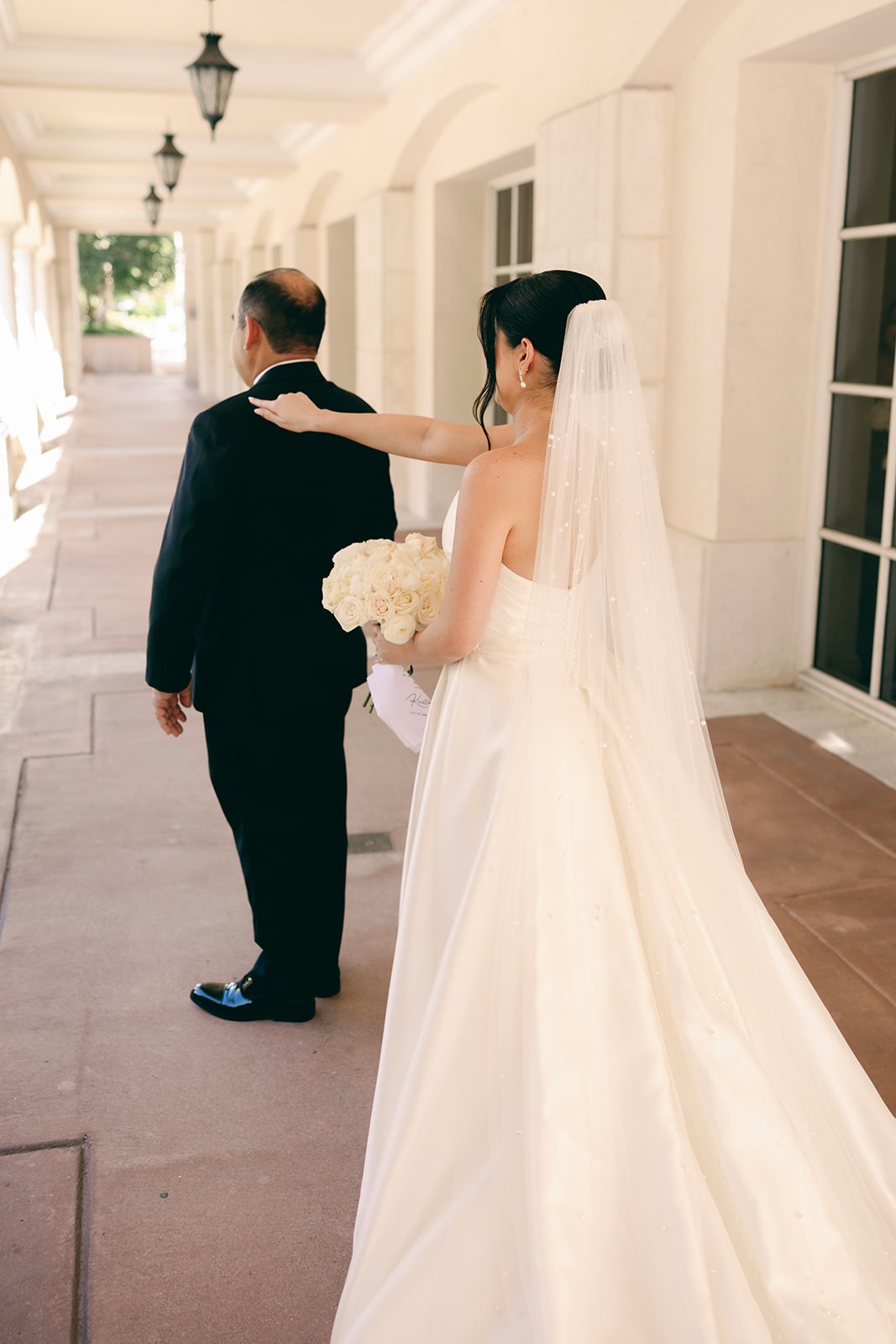 the bride approaching her dad in her miami wedding photos