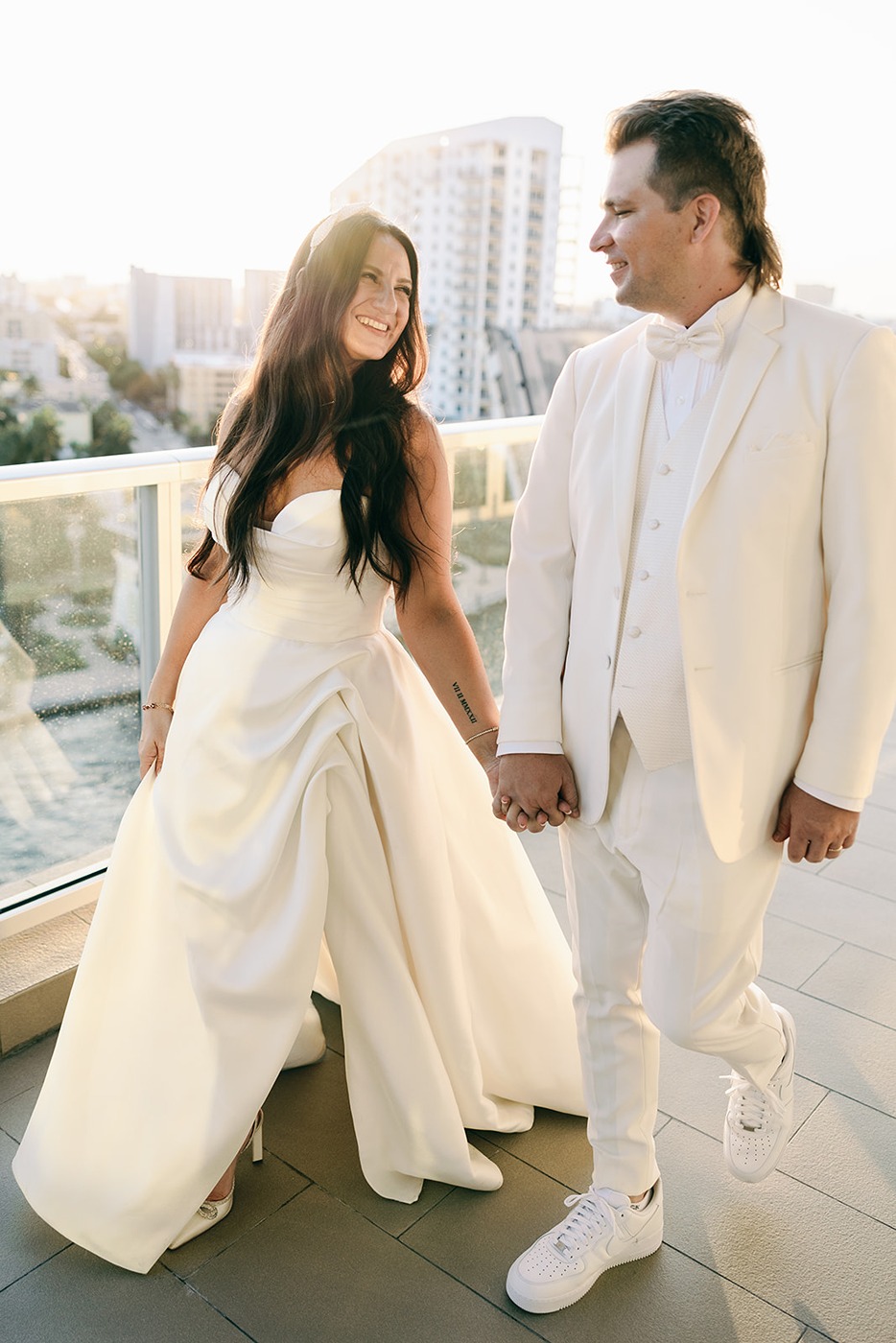 photos of the bride and groom at the penthouse at riverside wharf