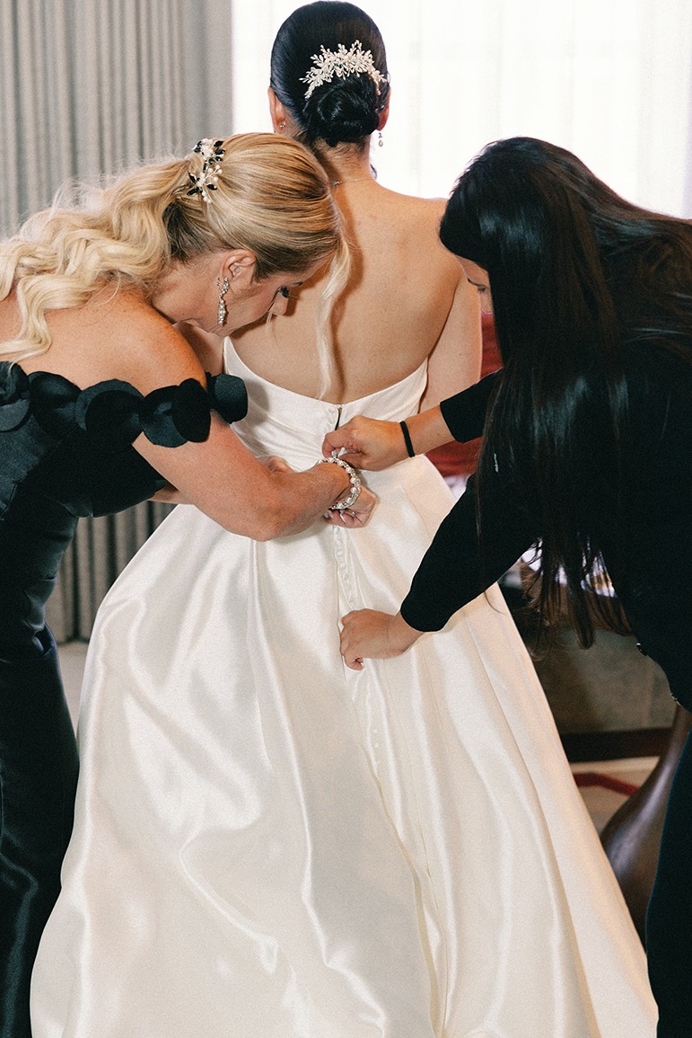 a bride getting ready for her church of the little flower miami florida wedding