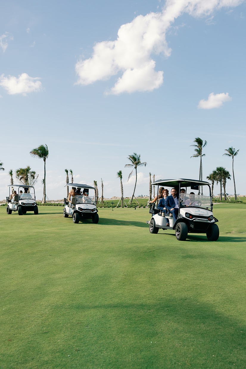south seas island resort wedding photos of the bridal party in golf carts