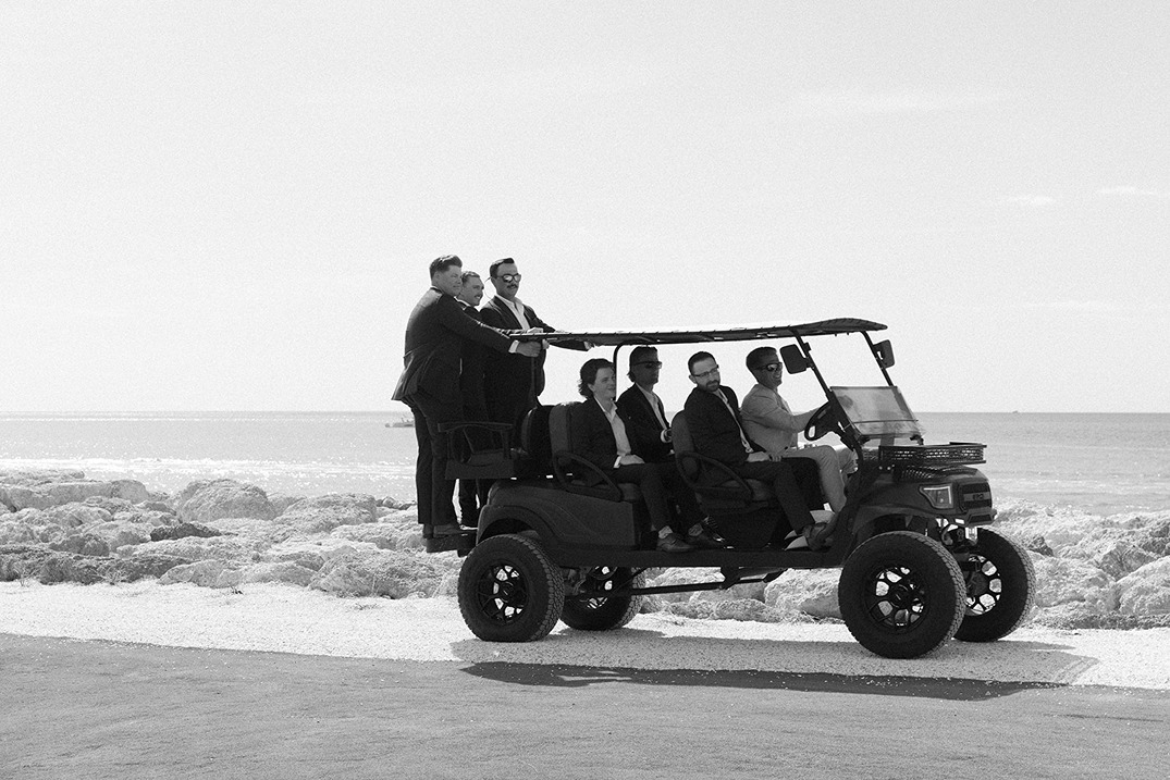 south seas island resort wedding photo of the groomsmen on a golf cart