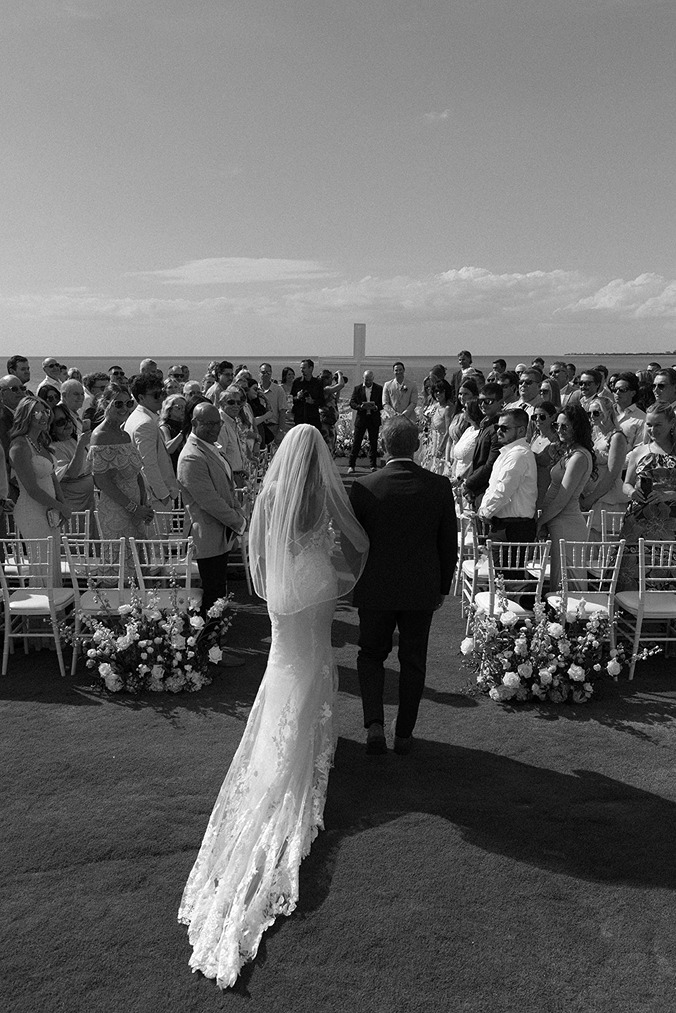 south seas resort wedding photos of the bride and her dad walking down the aisle