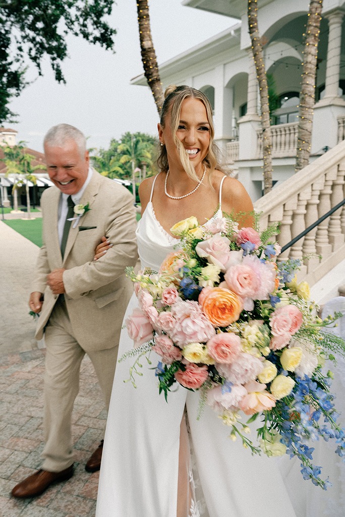 he club at the strand wedding photo of the bride walking with her father