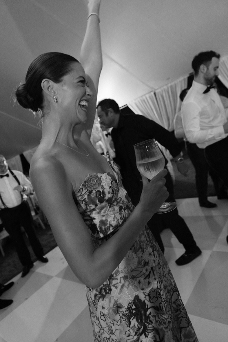 a wedding guest partying at a rosemary beach wedding