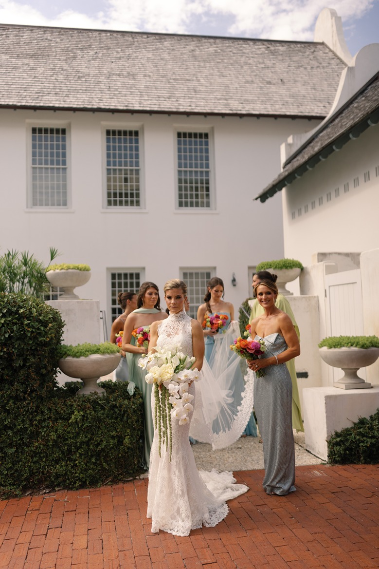Photos of the bride with her bridesmaids at her rosemary beach wedding